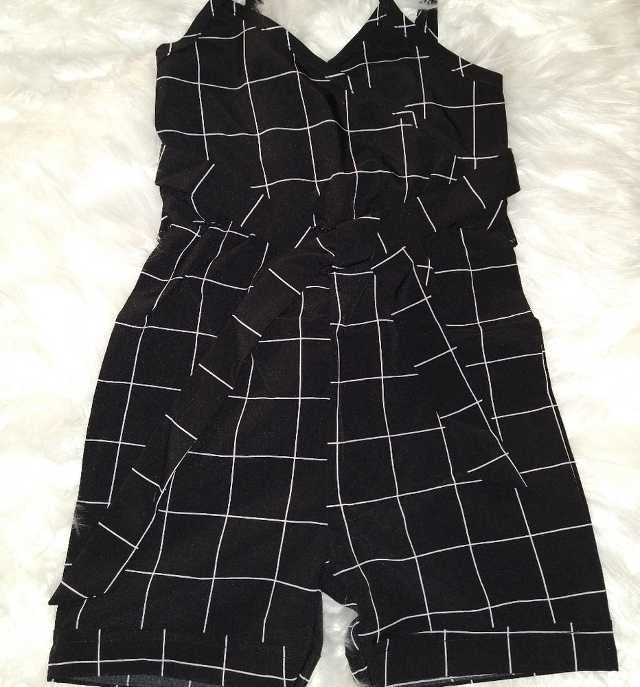 Girls black jumpsuit with straps.